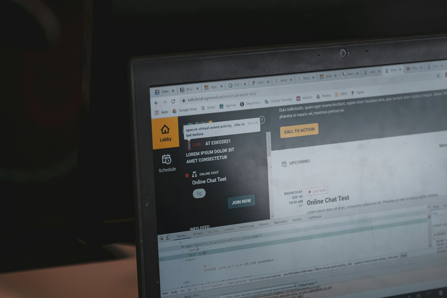 Laptop screen showing a virtual event platform with chat and schedule.